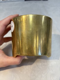 A Chinese bronze cylindrical tripod censer, Xuande mark, 18th C.