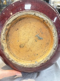 A large Chinese flamb&eacute;-glazed 'yuhuchunping' vase on a wooden stand, 19th C.