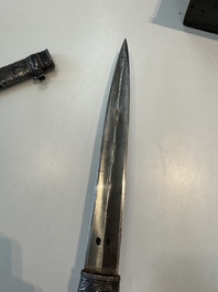 A Caucasian walrus bone-hilted kindjal with niello silver mounts, 19th C.