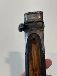 A Caucasian walrus bone-hilted kindjal with niello silver mounts, 19th C.