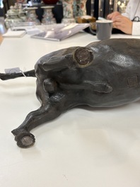 A Japanese bronze okimono of a tiger and a bull, signed Sano Takachika 佐野隆親, Meiji, 19th C.