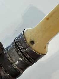 A Caucasian walrus bone-hilted kindjal with niello silver mounts, 19th C.