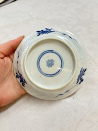 A set of four Chinese blue and white cups and saucers, flower mark, 19th C.