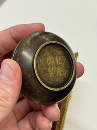 A Chinese gilt and silver inlaid bronze ink paste box and cover and with presentation box, Qianlong mark and possibly of the period