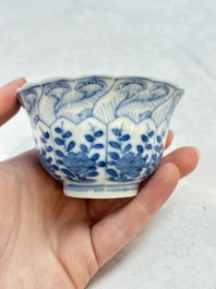 A set of four Chinese blue and white cups and saucers, flower mark, 19th C.