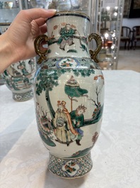 A pair of Chinese famille verte vases with narrative design, 19th C.
