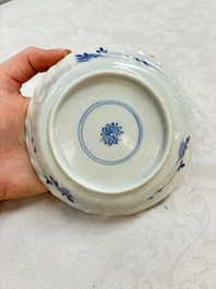 A set of four Chinese blue and white cups and saucers, flower mark, 19th C.