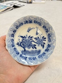 A set of four Chinese blue and white cups and saucers, flower mark, 19th C.