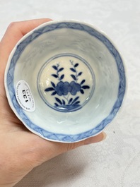 A set of four Chinese blue and white cups and saucers, flower mark, 19th C.