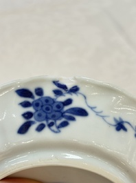 A set of four Chinese blue and white cups and saucers, flower mark, 19th C.