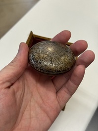 A Chinese gilt and silver inlaid bronze ink paste box and cover and with presentation box, Qianlong mark and possibly of the period
