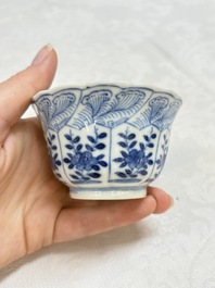 A set of four Chinese blue and white cups and saucers, flower mark, 19th C.