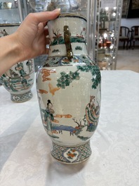 A pair of Chinese famille verte vases with narrative design, 19th C.