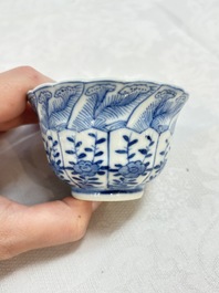 A set of four Chinese blue and white cups and saucers, flower mark, 19th C.