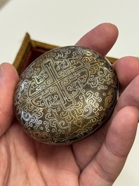 A Chinese gilt and silver inlaid bronze ink paste box and cover and with presentation box, Qianlong mark and possibly of the period