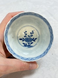 A set of four Chinese blue and white cups and saucers, flower mark, 19th C.