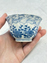 A set of four Chinese blue and white cups and saucers, flower mark, 19th C.