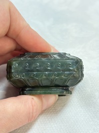 A small Chinese spinach-green jade covered box and two white jade pendants, 18/19th C.