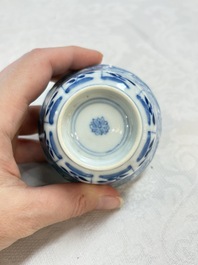 A set of four Chinese blue and white cups and saucers, flower mark, 19th C.