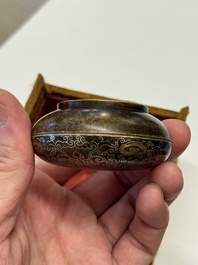 A Chinese gilt and silver inlaid bronze ink paste box and cover and with presentation box, Qianlong mark and possibly of the period