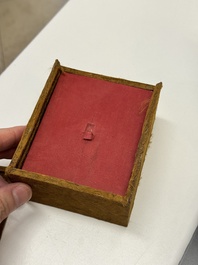 A Chinese gilt and silver inlaid bronze ink paste box and cover and with presentation box, Qianlong mark and possibly of the period