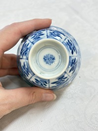 A set of four Chinese blue and white cups and saucers, flower mark, 19th C.