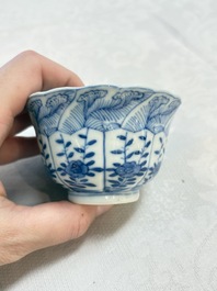 A set of four Chinese blue and white cups and saucers, flower mark, 19th C.