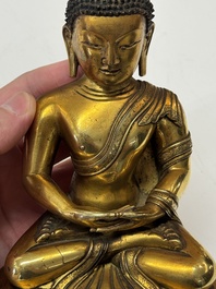 A fine Sino-Tibetan gilt-bronze figure of Buddha Shakyamuni, 17th C.