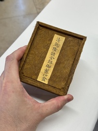 A Chinese gilt and silver inlaid bronze ink paste box and cover and with presentation box, Qianlong mark and possibly of the period