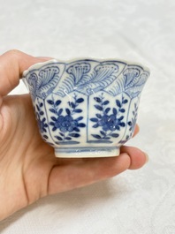 A set of four Chinese blue and white cups and saucers, flower mark, 19th C.