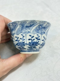 A set of four Chinese blue and white cups and saucers, flower mark, 19th C.