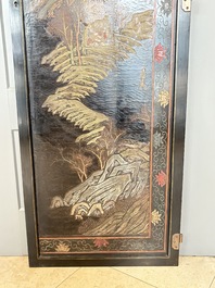 A Chinese Coromandel lacquered four-panel folding screen with mountainous landscapes, 17/18th C.