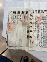 A large collection of 14 Chinese title deeds, 11 share applications, and a land law manual, 19/20th C.