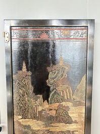 A Chinese Coromandel lacquered four-panel folding screen with mountainous landscapes, 17/18th C.
