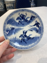 A set of 11 Chinese blue and white 'rabbit hunt' cups and saucers, Qianlong mark, 19th C.