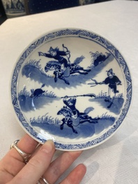 A set of 11 Chinese blue and white 'rabbit hunt' cups and saucers, Qianlong mark, 19th C.