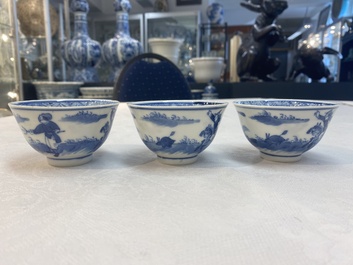 A set of 11 Chinese blue and white 'rabbit hunt' cups and saucers, Qianlong mark, 19th C.