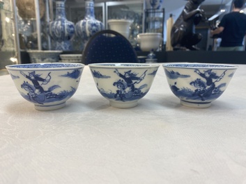 A set of 11 Chinese blue and white 'rabbit hunt' cups and saucers, Qianlong mark, 19th C.