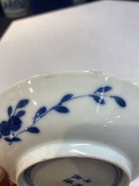 A set of 11 Chinese blue and white 'rabbit hunt' cups and saucers, Qianlong mark, 19th C.