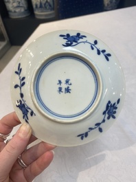 A set of 11 Chinese blue and white 'rabbit hunt' cups and saucers, Qianlong mark, 19th C.