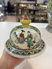 A pair of Chinese famille verte yellow-ground 'Xi Xiang Ji' vases and covers, 19th C.