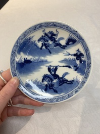 A set of 11 Chinese blue and white 'rabbit hunt' cups and saucers, Qianlong mark, 19th C.