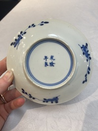 A set of 11 Chinese blue and white 'rabbit hunt' cups and saucers, Qianlong mark, 19th C.