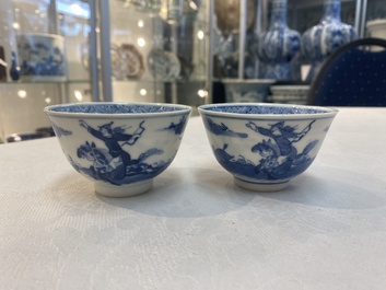 A set of 11 Chinese blue and white 'rabbit hunt' cups and saucers, Qianlong mark, 19th C.