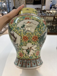 A pair of Chinese famille verte yellow-ground 'Xi Xiang Ji' vases and covers, 19th C.