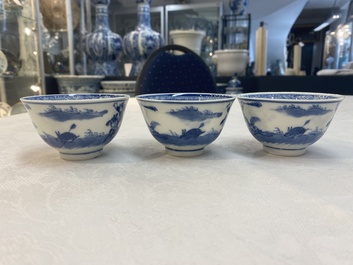 A set of 11 Chinese blue and white 'rabbit hunt' cups and saucers, Qianlong mark, 19th C.