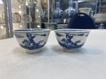 A set of 11 Chinese blue and white 'rabbit hunt' cups and saucers, Qianlong mark, 19th C.