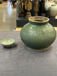 A Chinese Longquan celadon 'lotus' bowl and a large green-glazed Shiwan jar, Ming and later