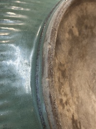 A Chinese Longquan celadon 'lotus' bowl and a large green-glazed Shiwan jar, Ming and later