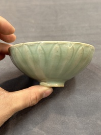 A Chinese Longquan celadon 'lotus' bowl and a large green-glazed Shiwan jar, Ming and later